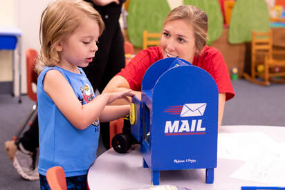Child playing with mailbox